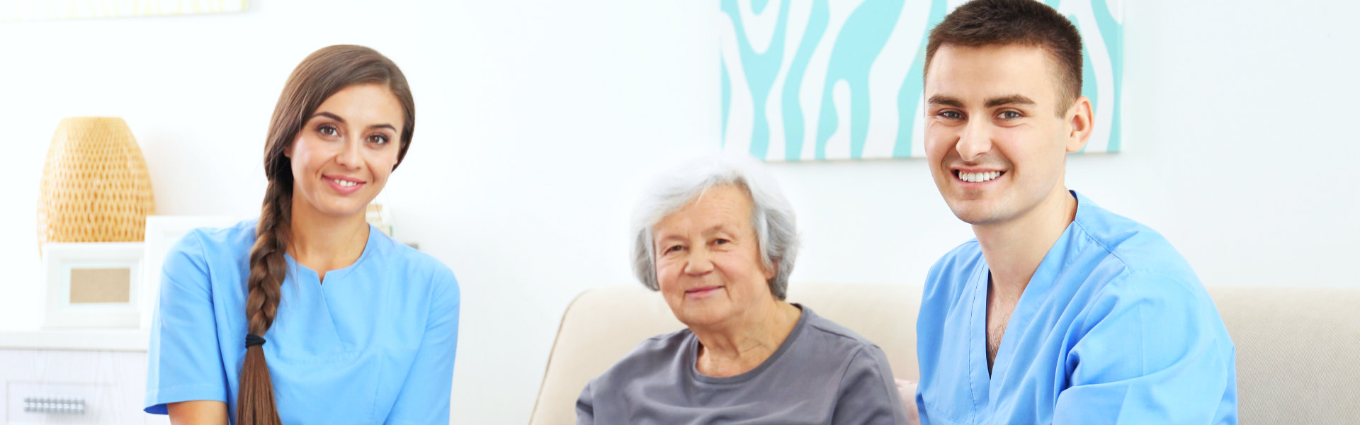 elderly woman and nurses smiling