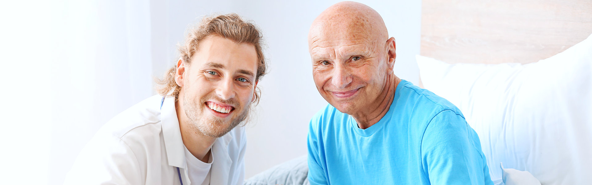 nurse and elderly man smiling